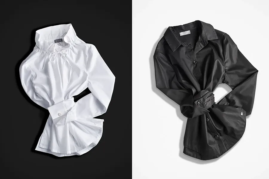 zwei Damenblusen schwarz und weiß, Flatshot Flatlay Fotografie . E-Commerce optimierte Produktfotos Kleidung von Fashionshots Linz.